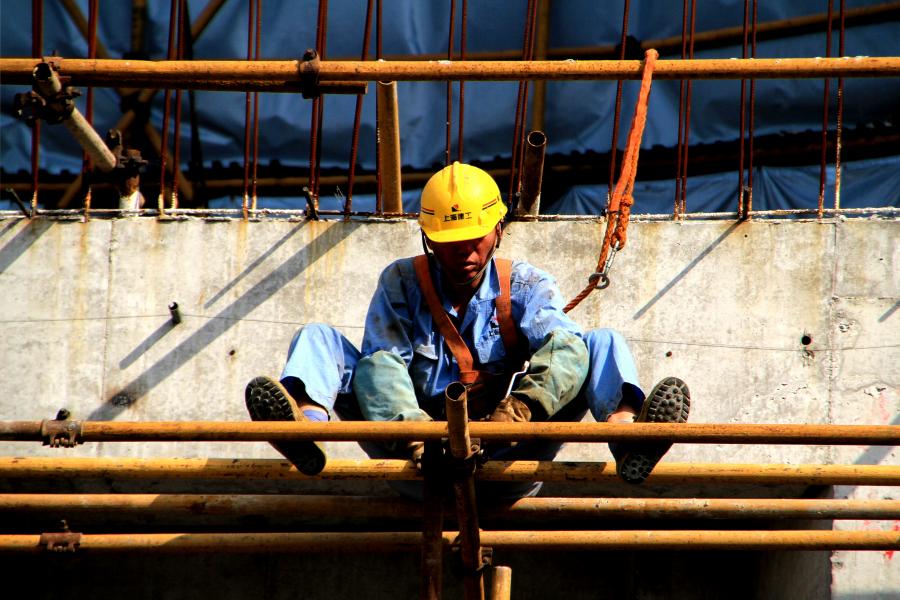 Construction Worker on Scaffold Redeveloping Shanghai's Old 