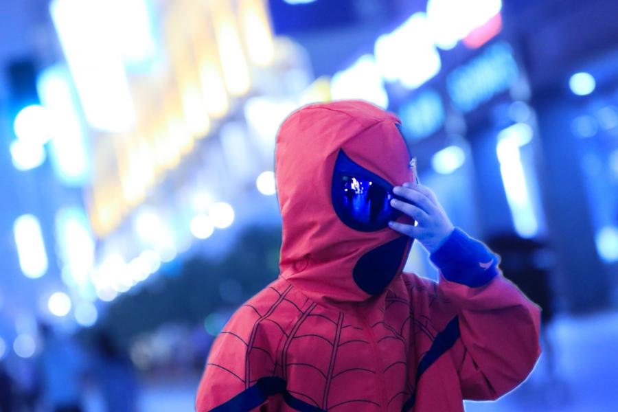 A Boy in Protective Clothing Makes A Gesture Not Unlike a Cl