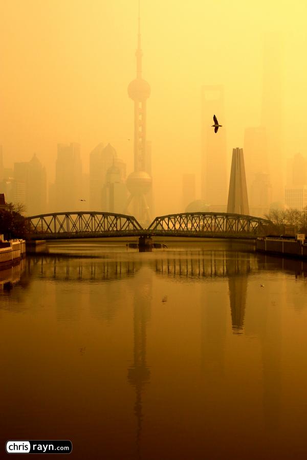 Shanghai's Skyscrapers at the River Blanketed by Smog 