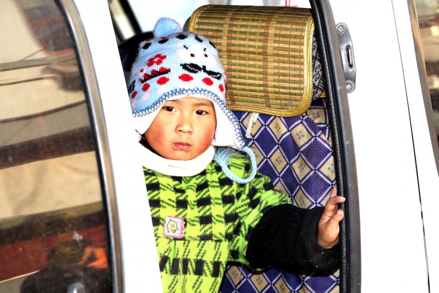 Baby in Street Vendor's Van at Laoximen