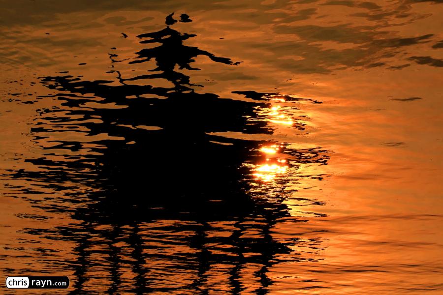 Reflection of Chinese Pavilion's Roof Set Afire by Sunset
