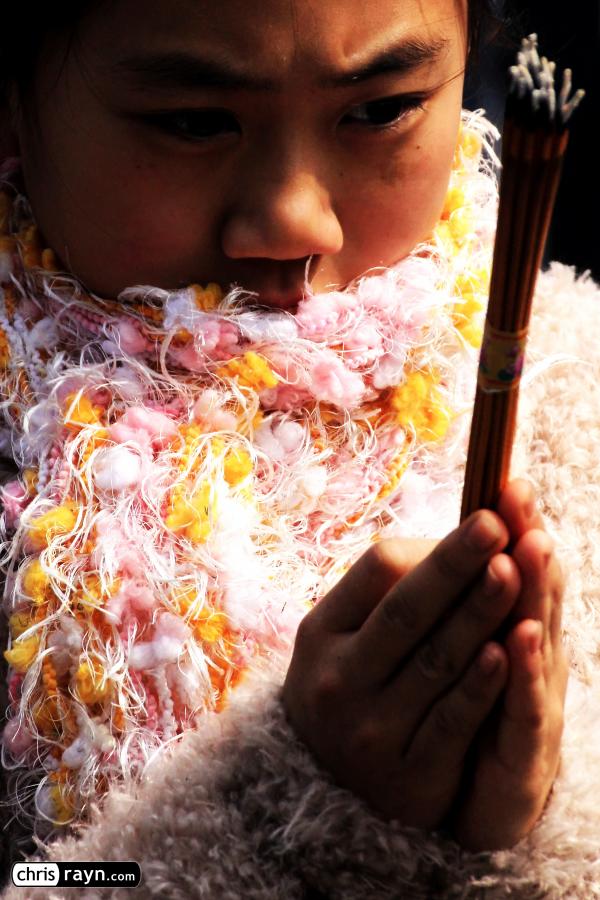 A scarf-clad Chinese girl shares her look into the future