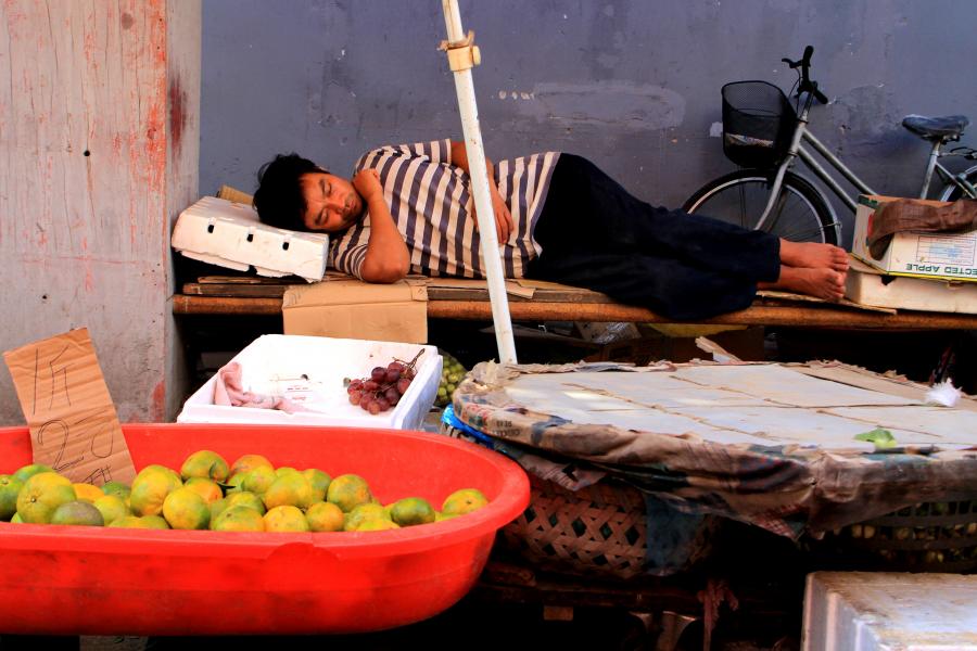 Sleeping Vendor in Laoximen Street Market