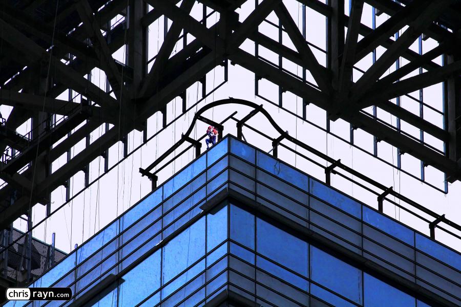 Welder clad in red at the top of new skyscraper construction