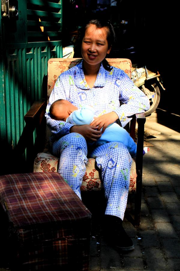 Local Woman with Her Baby in Shanghai's Old Town