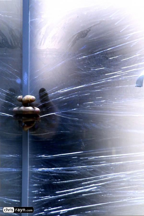 Shadow of a Worker Installing a Window Pane